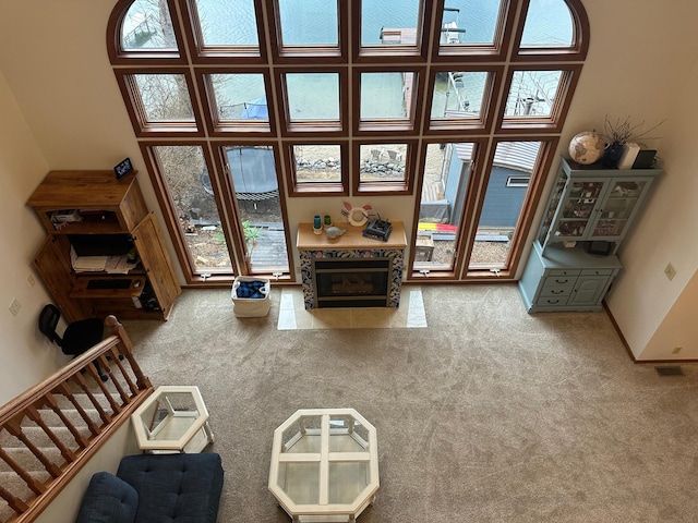 5060 Condons St SE, Prior Lake, MN 55372 - carpeted living area with a premium fireplace and stairs