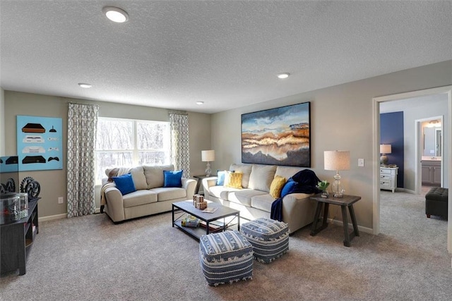 living room featuring carpet floors, recessed lighting, a textured ceiling, and baseboards