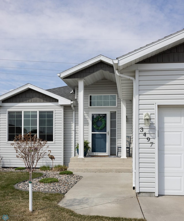 3497 50th St S, Fargo, ND 58104 - doorway to property featuring an attached garage