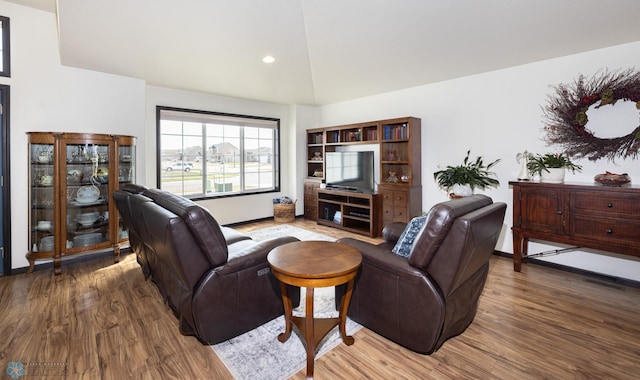 3497 50th St S, Fargo, ND 58104 - living room featuring wood finished floors, lofted ceiling, baseboards, and recessed lighting