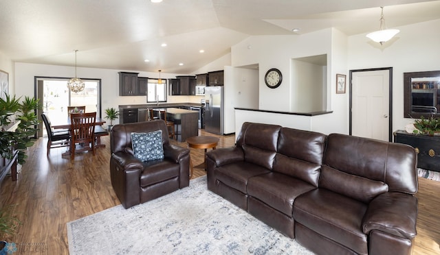 3497 50th St S, Fargo, ND 58104 - living area featuring vaulted ceiling, dark wood-style floors, a chandelier, and recessed lighting