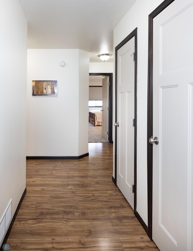 3497 50th St S, Fargo, ND 58104 - hall featuring dark wood-type flooring and baseboards