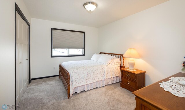 3497 50th St S, Fargo, ND 58104 - bedroom featuring light colored carpet, baseboards, and a closet