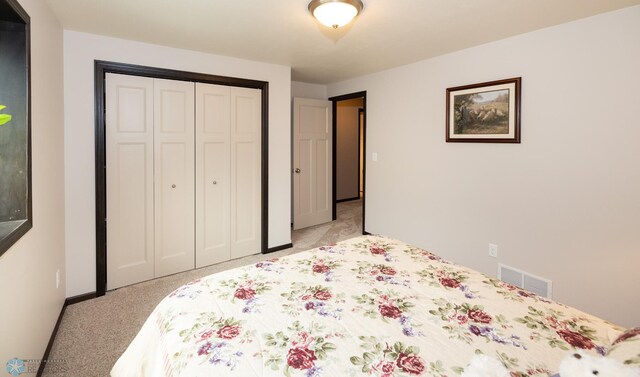 3497 50th St S, Fargo, ND 58104 - bedroom with light carpet, a closet, and baseboards