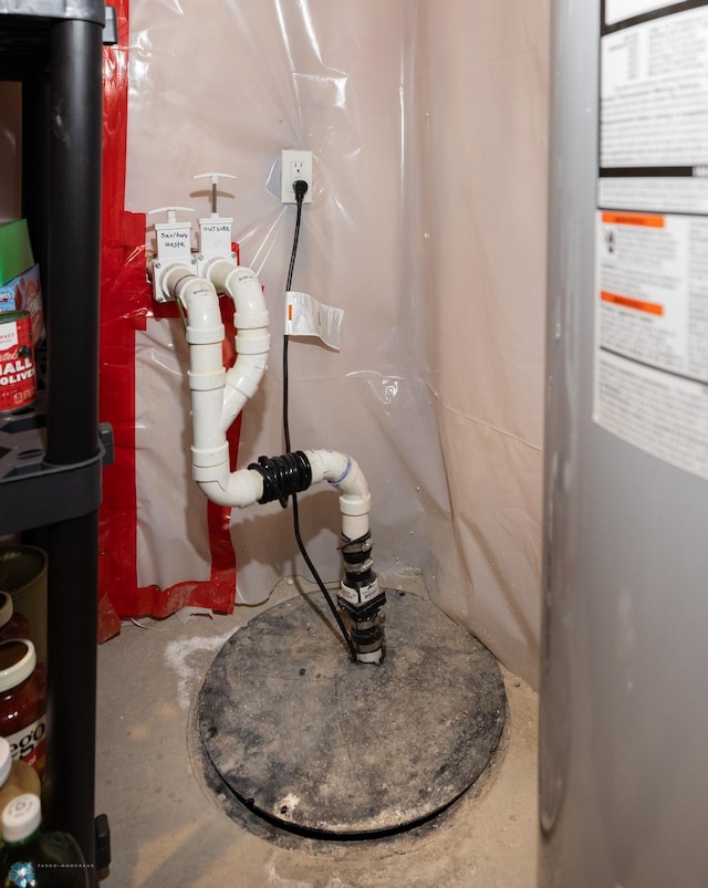3497 50th St S, Fargo, ND 58104 - detailed view of concrete flooring and water heater