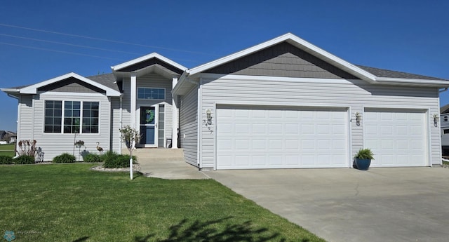 3497 50th St S, Fargo, ND 58104 - ranch-style house featuring concrete driveway, a garage, and a front lawn