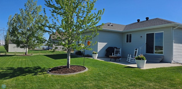 3497 50th St S, Fargo, ND 58104 - rear view of house with a yard and a patio