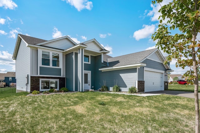 18872 Fillmore St NW, Elk River, MN 55330 - view of front of house featuring a garage, driveway, a front yard, stone siding, and a shingled roof