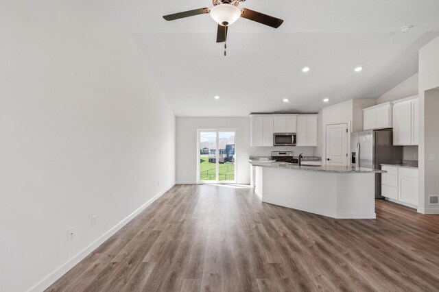 18872 Fillmore St NW, Elk River, MN 55330 - kitchen with appliances with stainless steel finishes, a ceiling fan, wood finished floors, white cabinetry, and recessed lighting