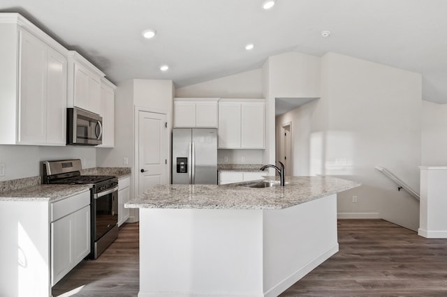18872 Fillmore St NW, Elk River, MN 55330 - kitchen featuring stainless steel appliances, a sink, white cabinetry, vaulted ceiling, and a kitchen island with sink