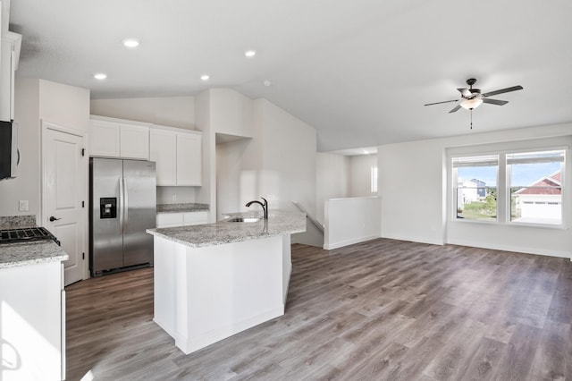 18872 Fillmore St NW, Elk River, MN 55330 - kitchen with stainless steel refrigerator with ice dispenser, ceiling fan, a sink, white cabinets, and lofted ceiling