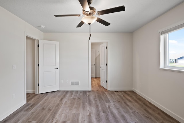 18872 Fillmore St NW, Elk River, MN 55330 - unfurnished bedroom with wood finished floors and baseboards