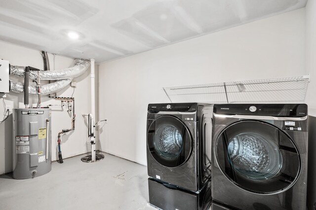 18872 Fillmore St NW, Elk River, MN 55330 - laundry room featuring electric water heater and washing machine and dryer