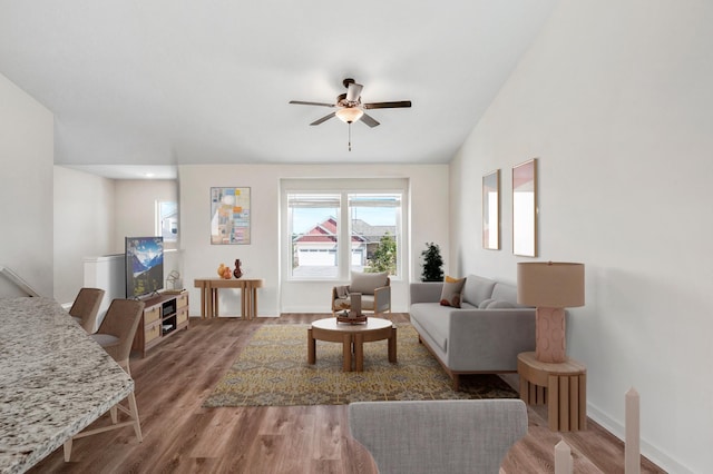 18872 Fillmore St NW, Elk River, MN 55330 - living room with ceiling fan, wood finished floors, and baseboards