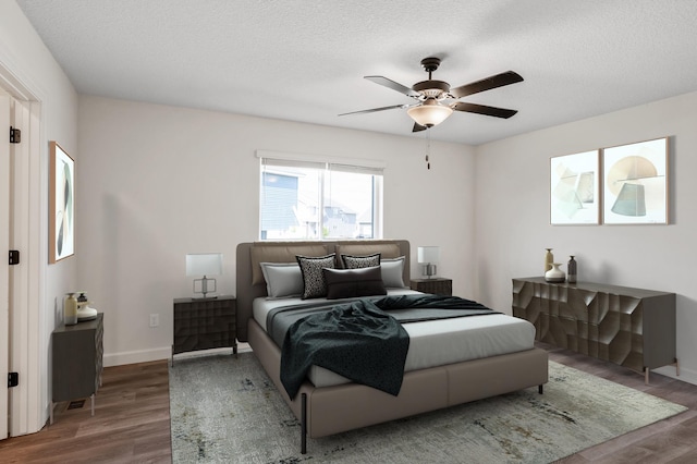 18872 Fillmore St NW, Elk River, MN 55330 - bedroom featuring wood finished floors, baseboards, a textured ceiling, and ceiling fan