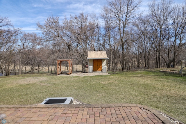 1311 Cossette Dr S, Fargo, ND 58104 - view of green lawn featuring a storage shed