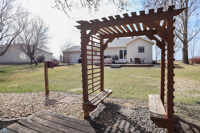 1311 Cossette Dr S, Fargo, ND 58104 - view of grassy yard featuring a pergola and a wooden deck