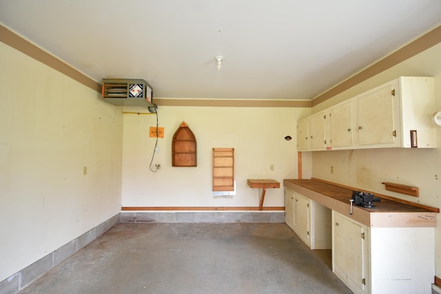 garage featuring baseboards