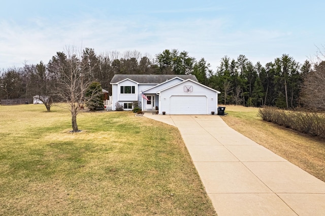 view of front of property with an attached garage, a front lawn, and concrete driveway