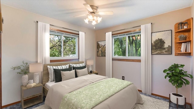 carpeted bedroom with a ceiling fan, baseboards, and multiple windows