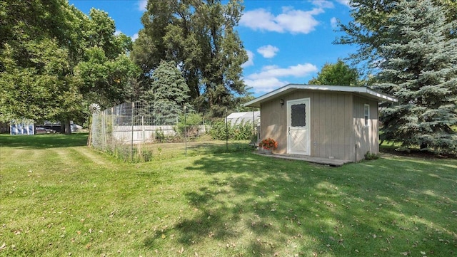 exterior space with a lawn and a shed