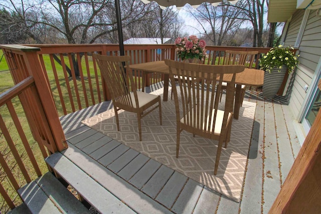 wooden deck featuring outdoor dining space