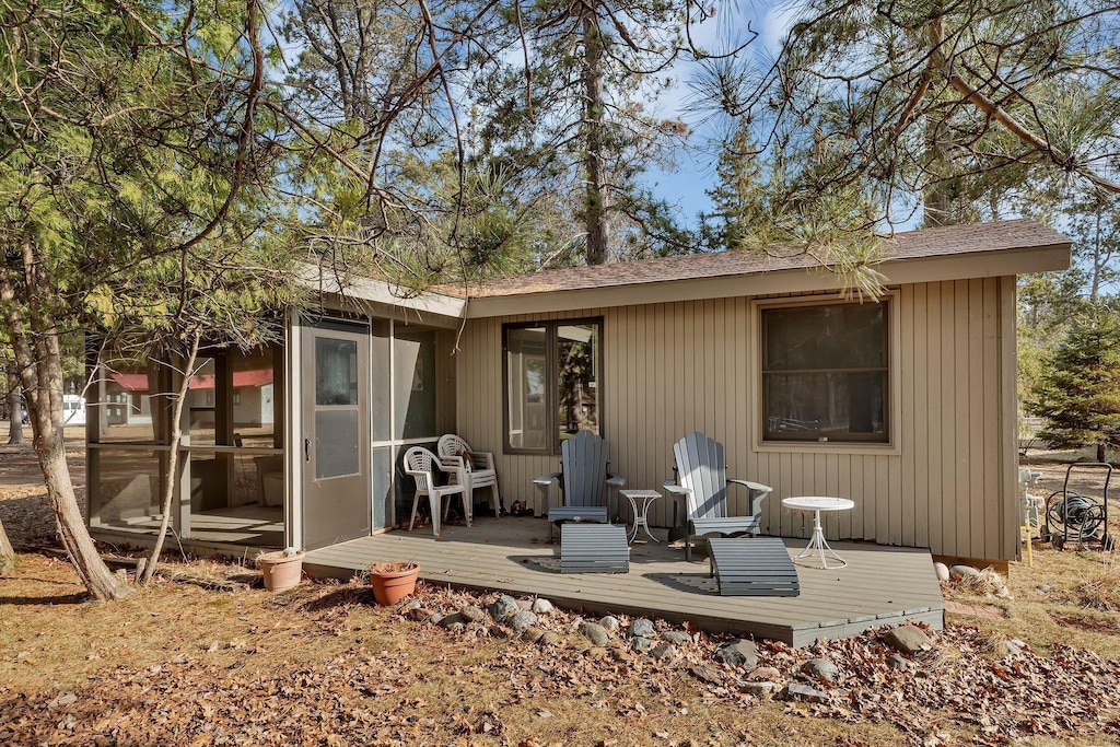 23744 Alluring Pines Dr, Nisswa, MN 56468 - rear view of house with a deck