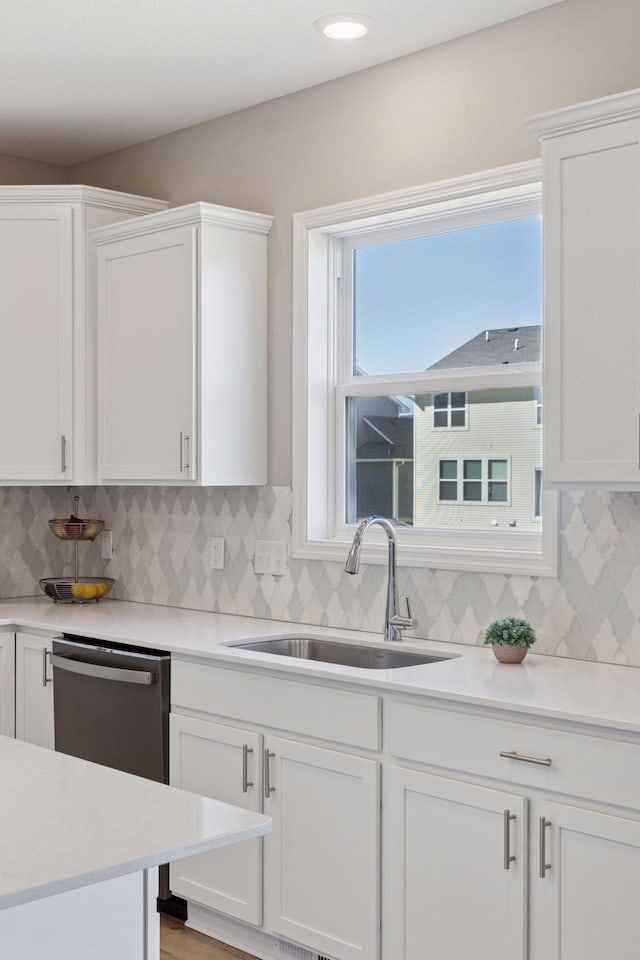 2141 Johanna Cir, Lino Lakes, MN 55038 - kitchen with a sink, white cabinetry, and dishwasher