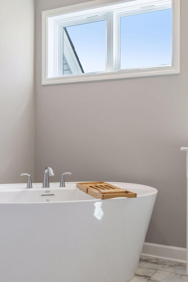 2141 Johanna Cir, Lino Lakes, MN 55038 - full bath with a freestanding bath, baseboards, and marble finish floor