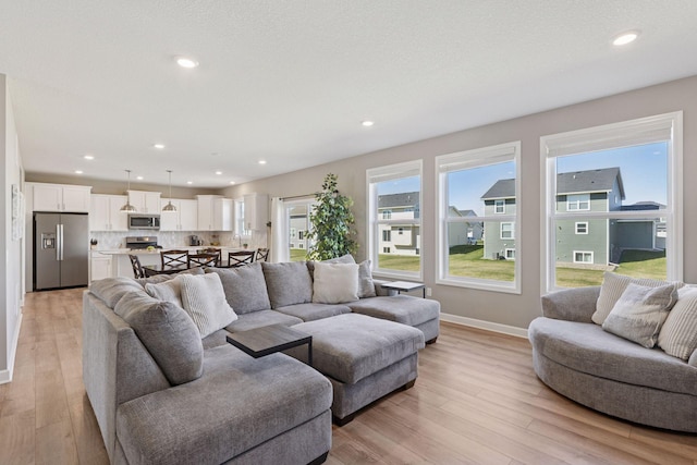 2141 Johanna Cir, Lino Lakes, MN 55038 - living area with recessed lighting, baseboards, and light wood-style flooring