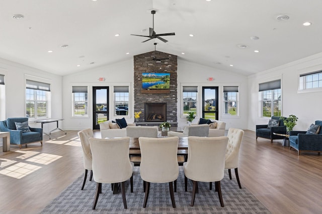 2141 Johanna Cir, Lino Lakes, MN 55038 - dining area with a ceiling fan, a stone fireplace, wood finished floors, baseboards, and recessed lighting