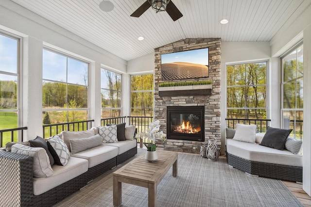 4233 Halstead Bay Alcove, Minnetrista, MN 55331 - sunroom / solarium featuring lofted ceiling, an outdoor living space with a fireplace, and a ceiling fan
