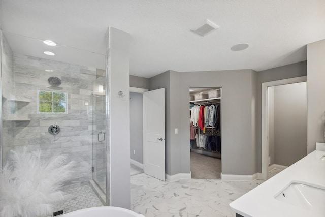 4233 Halstead Bay Alcove, Minnetrista, MN 55331 - full bathroom featuring marble finish flooring, a stall shower, a spacious closet, baseboards, and vanity