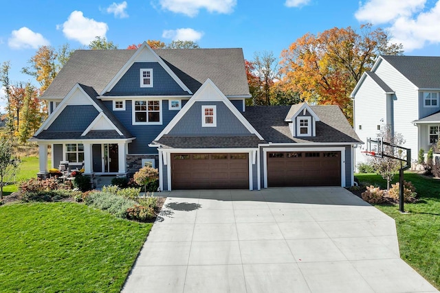 4233 Halstead Bay Alcove, Minnetrista, MN 55331 - view of front of house with a front lawn, driveway, a garage, and roof with shingles