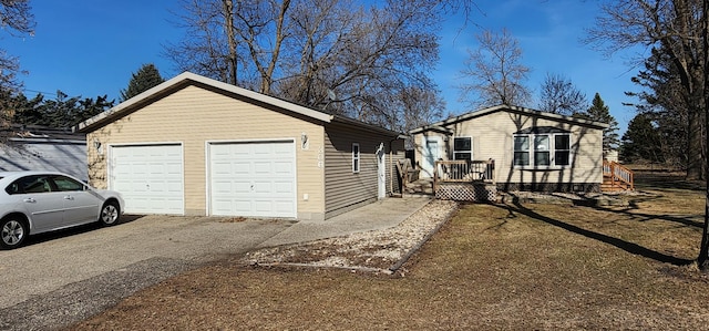 306 4th St S, Hoffman, MN 56339 - view of home's exterior featuring an outdoor structure and a detached garage