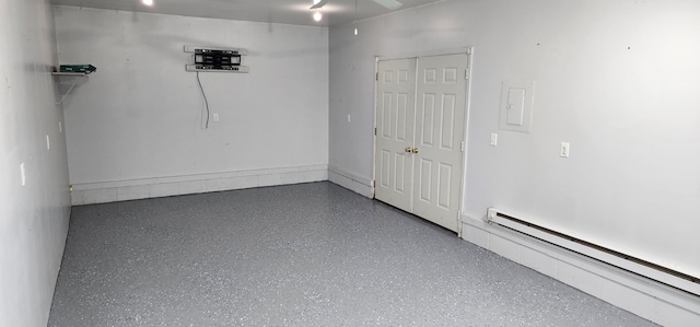 306 4th St S, Hoffman, MN 56339 - spare room featuring a baseboard radiator, speckled floor, and a ceiling fan