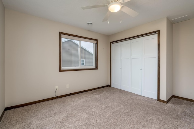 209 Plum Run, Le Sueur, MN 56058 - unfurnished bedroom featuring carpet flooring, baseboards, a closet, and a ceiling fan