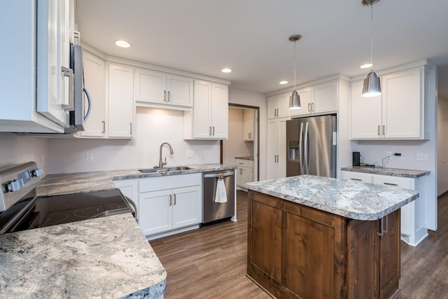 209 Plum Run, Le Sueur, MN 56058 - kitchen with stainless steel appliances, dark wood finished floors, white cabinetry, and recessed lighting
