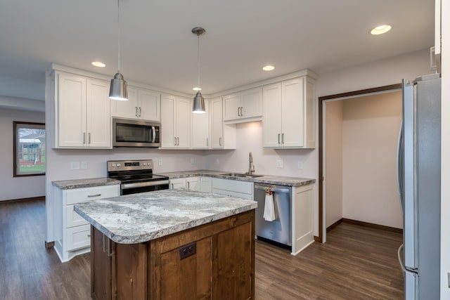 209 Plum Run, Le Sueur, MN 56058 - kitchen featuring stainless steel appliances, a sink, dark wood finished floors, recessed lighting, and white cabinets