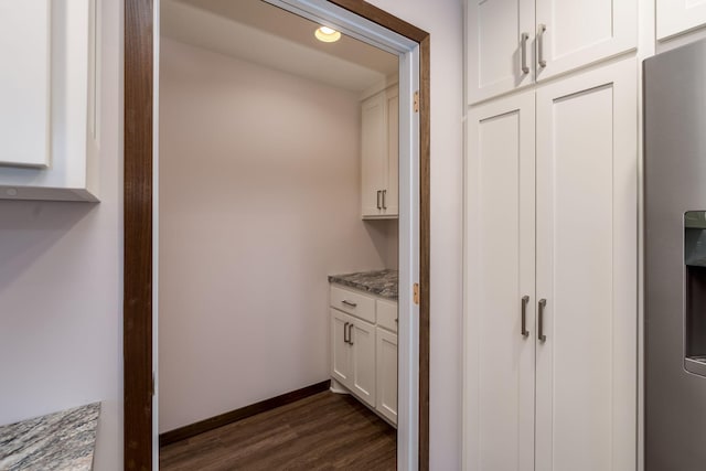 209 Plum Run, Le Sueur, MN 56058 - bar with dark wood-style floors, baseboards, recessed lighting, and stainless steel fridge with ice dispenser