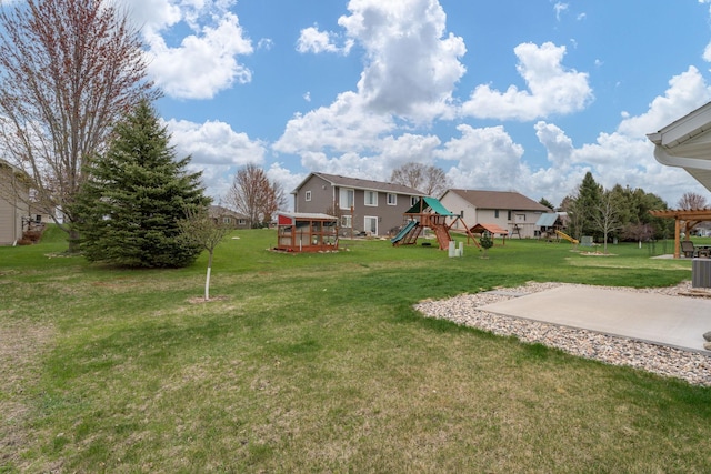 209 Plum Run, Le Sueur, MN 56058 - view of grassy yard with a playground and central AC