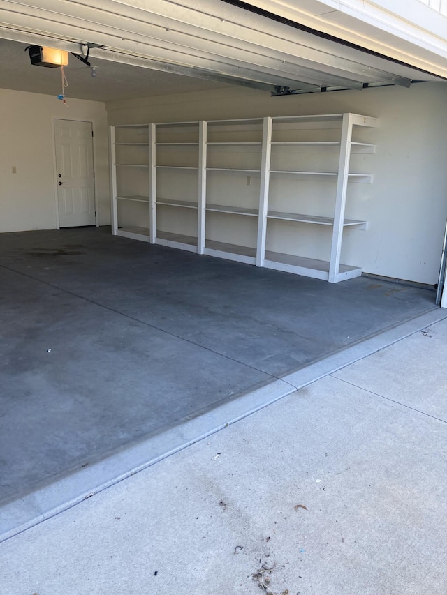 209 Plum Run, Le Sueur, MN 56058 - garage featuring a garage door opener