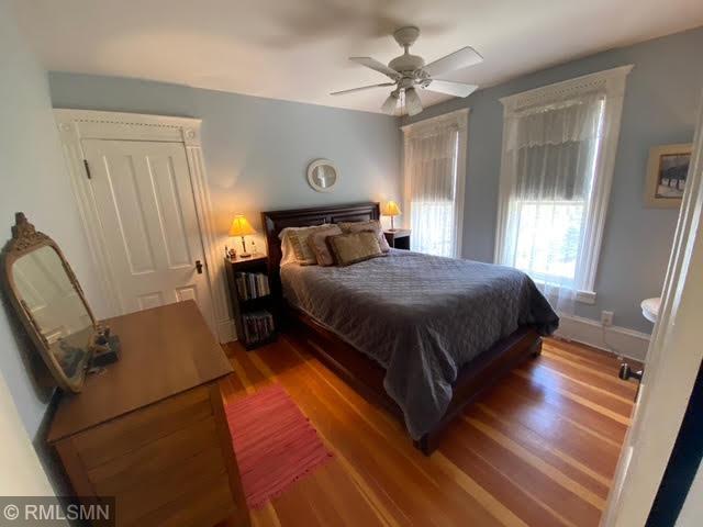 bedroom featuring a ceiling fan and wood finished floors