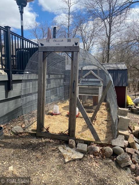 view of yard featuring exterior structure and an outdoor structure