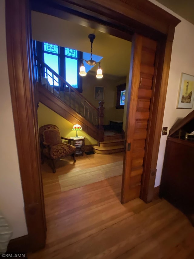 interior space featuring wood finished floors and stairs