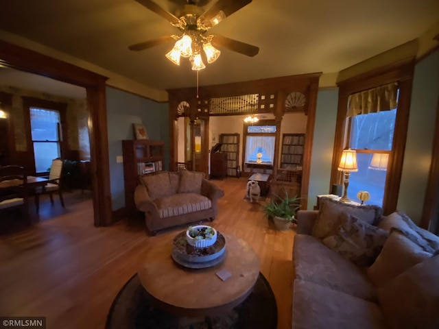 living room featuring wood finished floors and ceiling fan