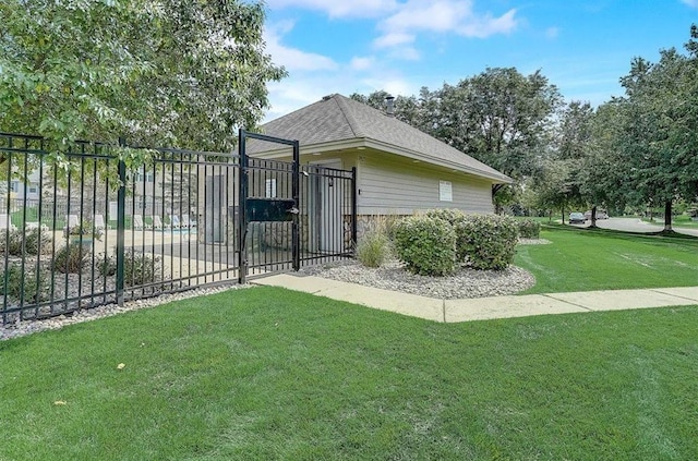 7619 Derby Ln, Shakopee, MN 55379 - view of side of home featuring a gate and roof with shingles