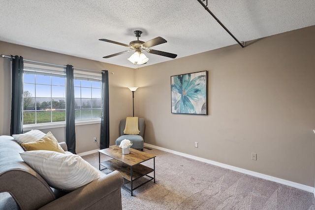 7619 Derby Ln, Shakopee, MN 55379 - carpeted living area featuring a textured ceiling, ceiling fan, and baseboards