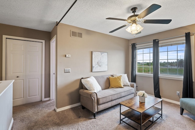 7619 Derby Ln, Shakopee, MN 55379 - carpeted living area with a textured ceiling, ceiling fan, and baseboards