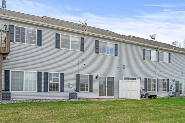 7619 Derby Ln, Shakopee, MN 55379 - back of house featuring central air condition unit and a yard
